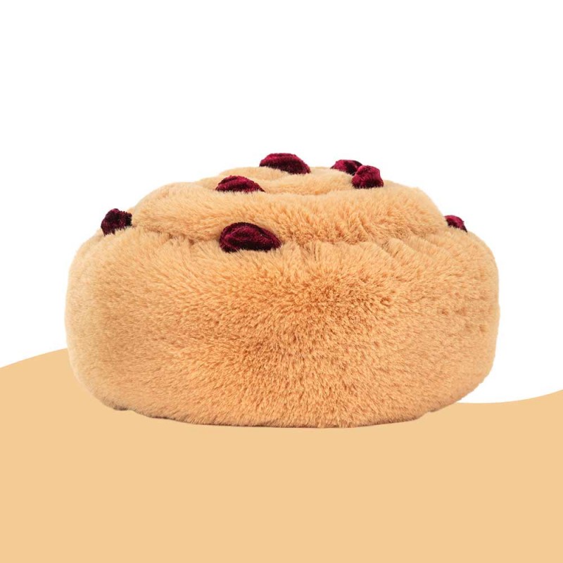 Peluche pour les enfants en forme de pain aux raisins.