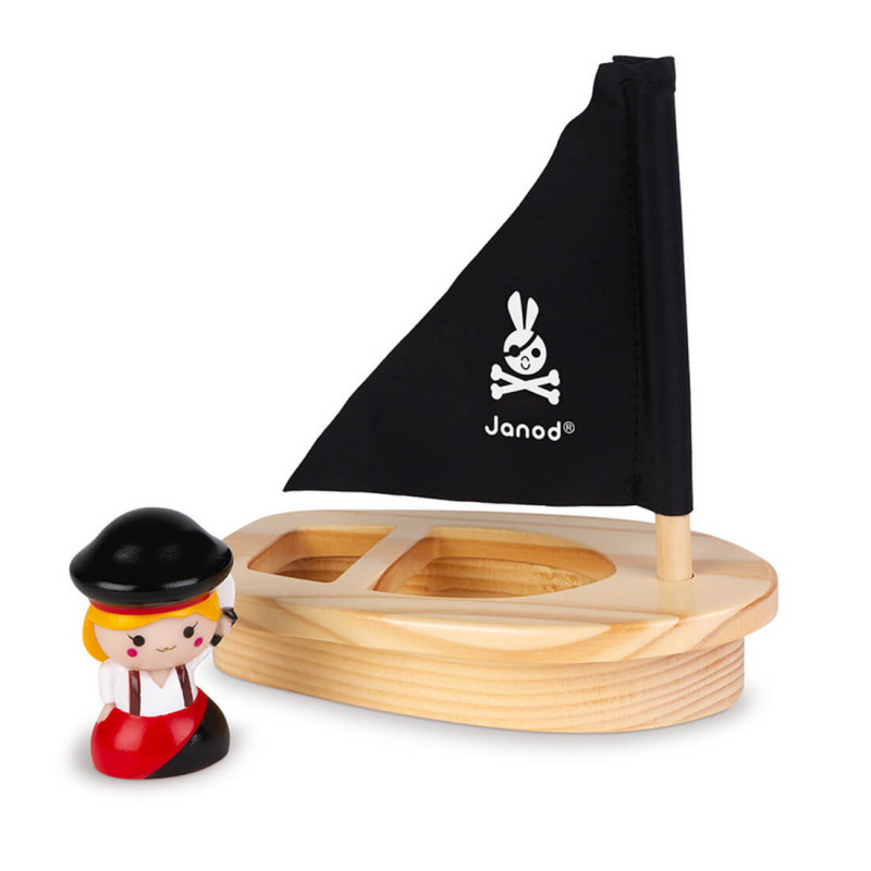 Le bateau en bois de pirate et un gicleur pour le bain de bébé