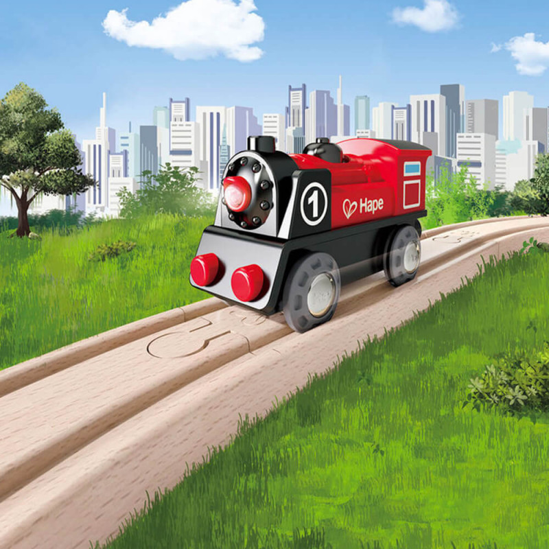 Locomotive rouge en bois sur rail